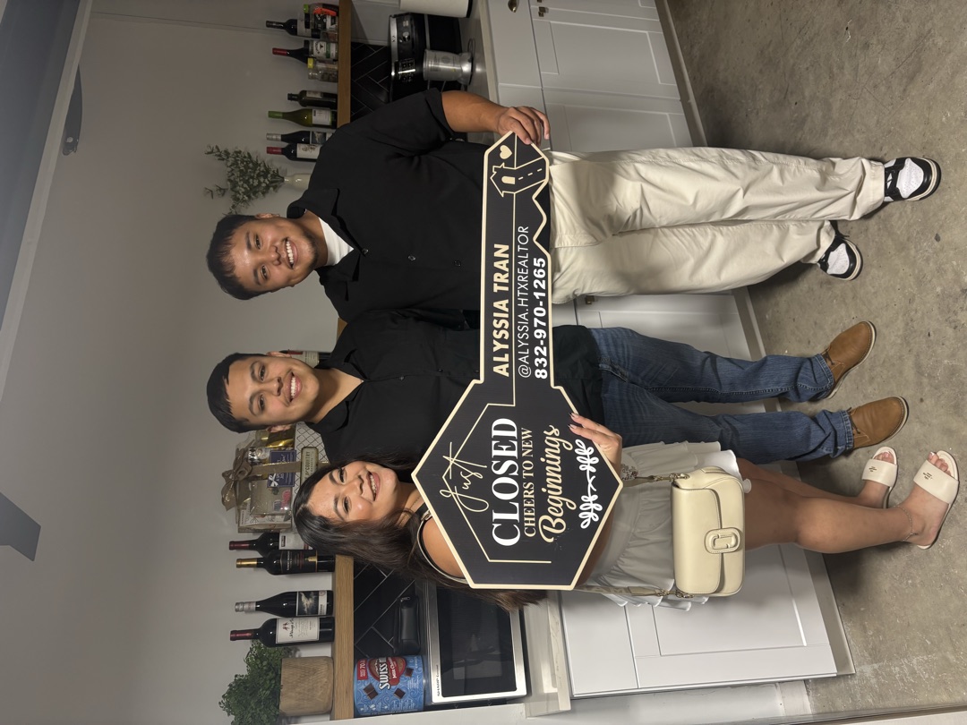 Happy homeowner at closing with Brandon Huynh